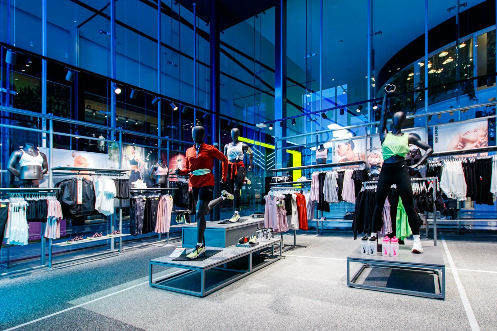 Sportswear store with mannequins and clothing rails