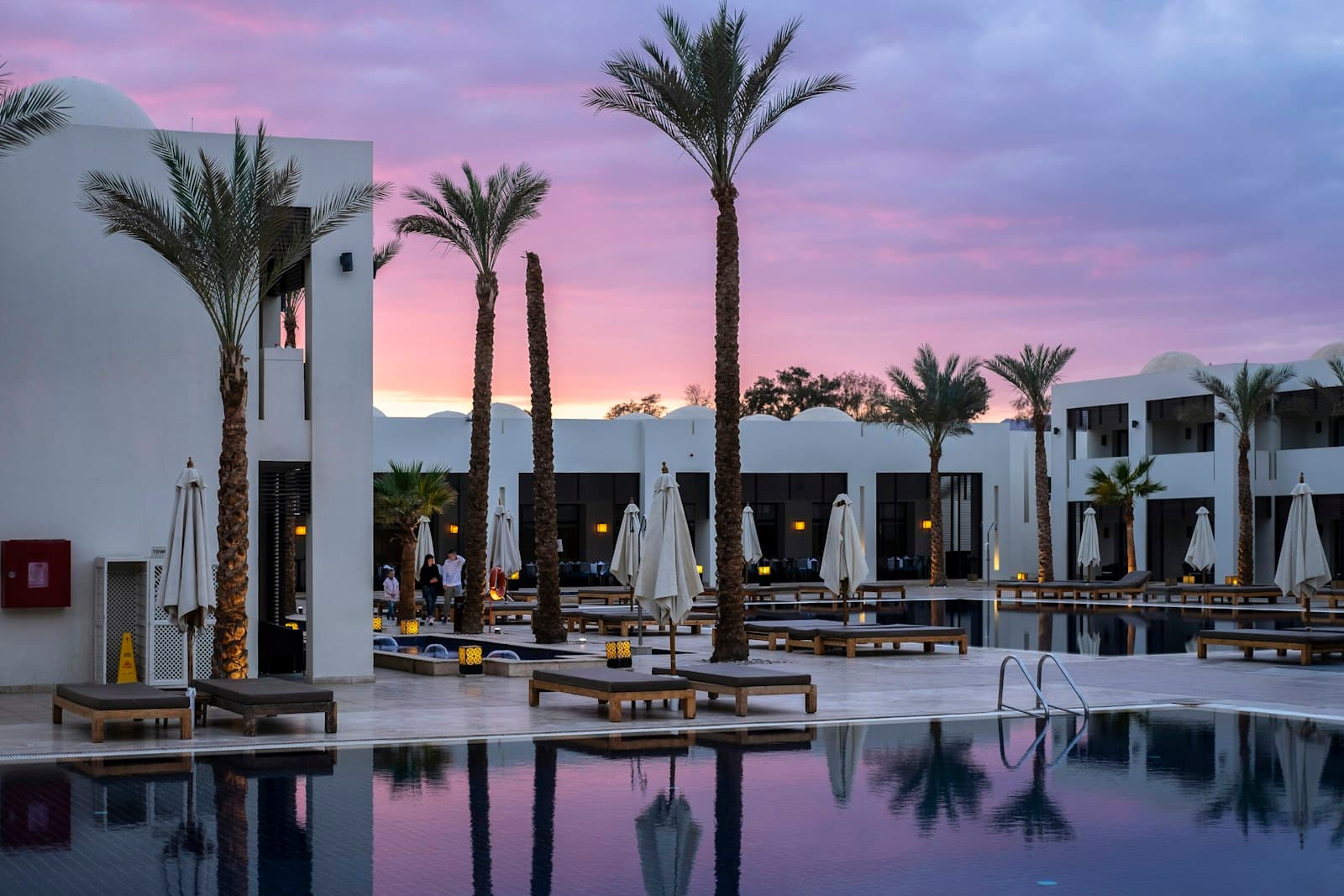 Hotel pool at sunset